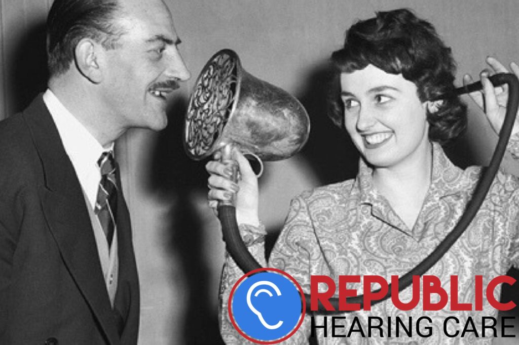 woman using old fashioned hearing device