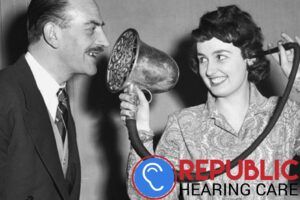 woman using old fashioned hearing device