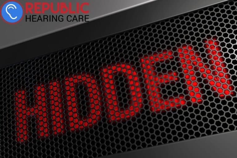 red neon sign that says hidden