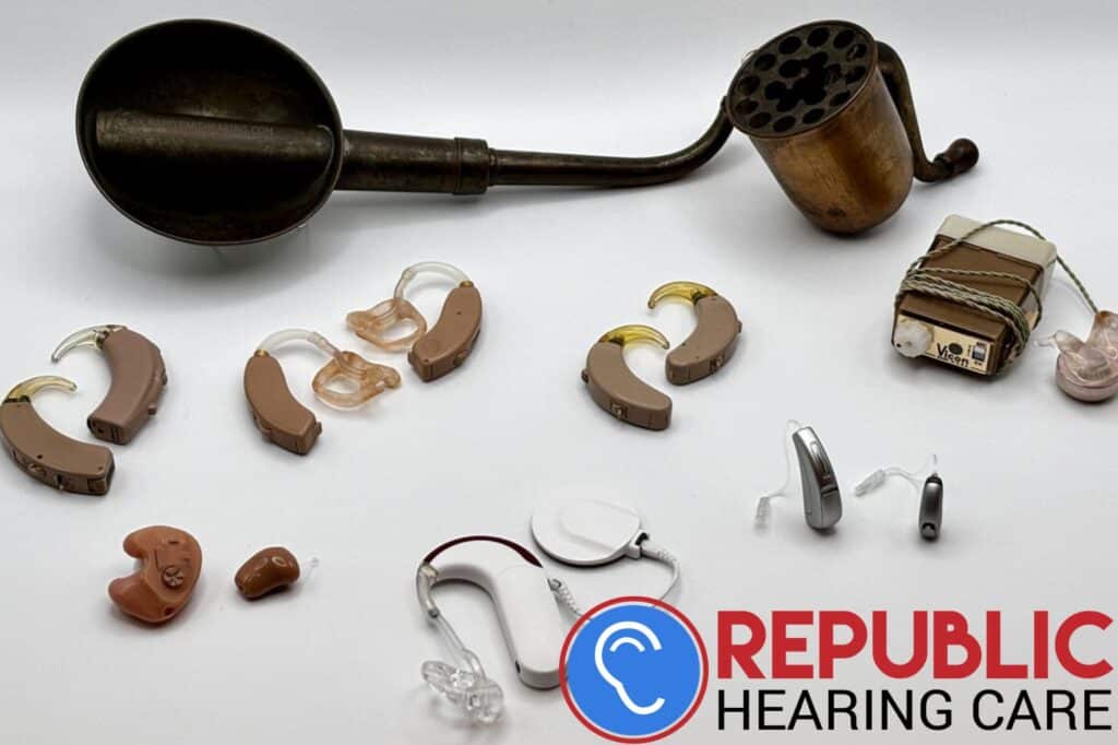 a selection of hearing aids throughout the years
