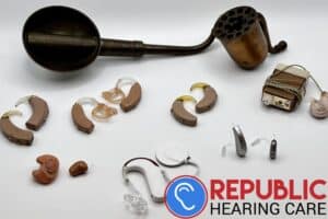 a selection of hearing aids throughout the years