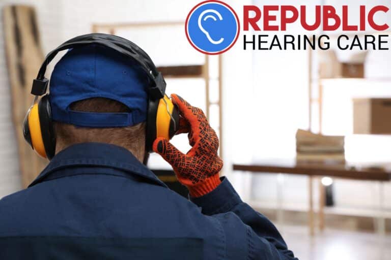man wearing work gloves and hearing protection